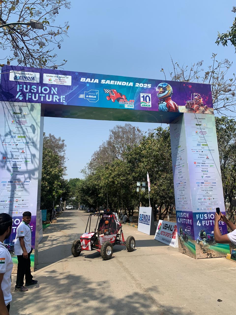 Team Avinya entering SAEINDIA eBAJA competition venue with electric ATV